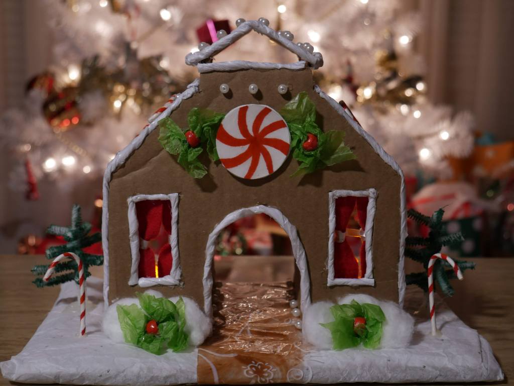 Gingerbread house with Christmas tree in back